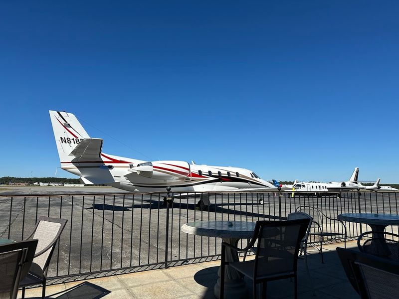 The Outdoor Patio With A Low Fence And A Front Row Seat