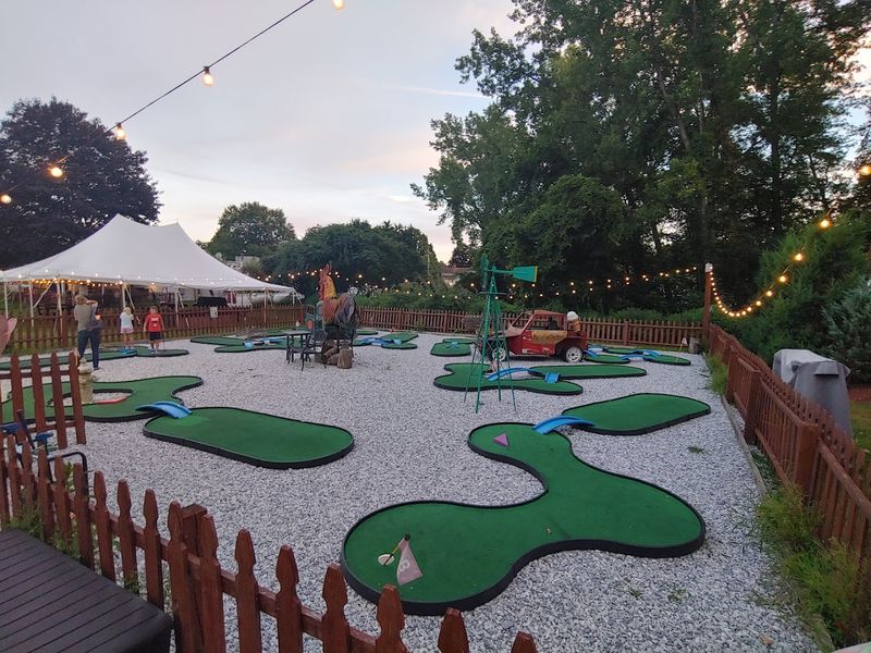 A Water Fountain, Mini Golf, And A Fire Pit