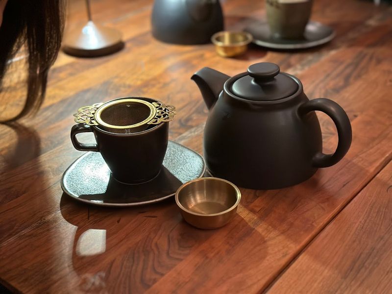 Steaming Teacups In A Quiet Literary Nook