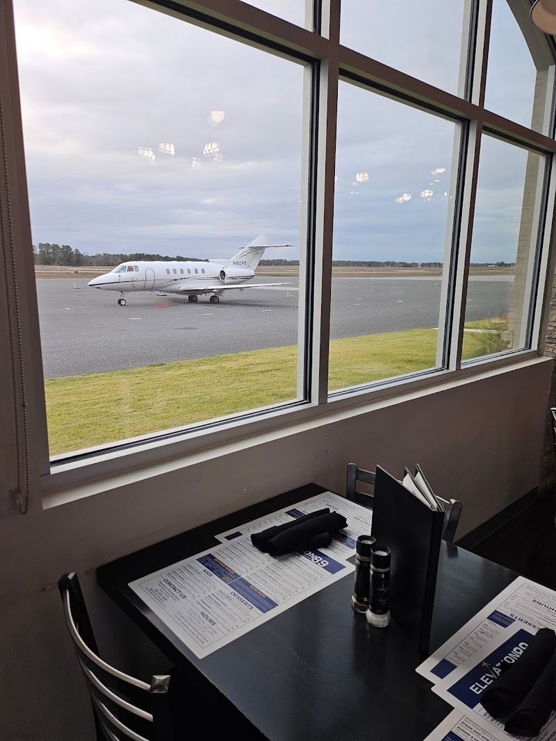 Floor To Ceiling Windows Overlooking The Runway