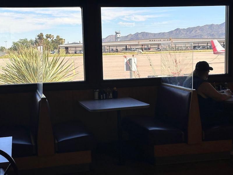 Large Windows Framing The Active Flight Line