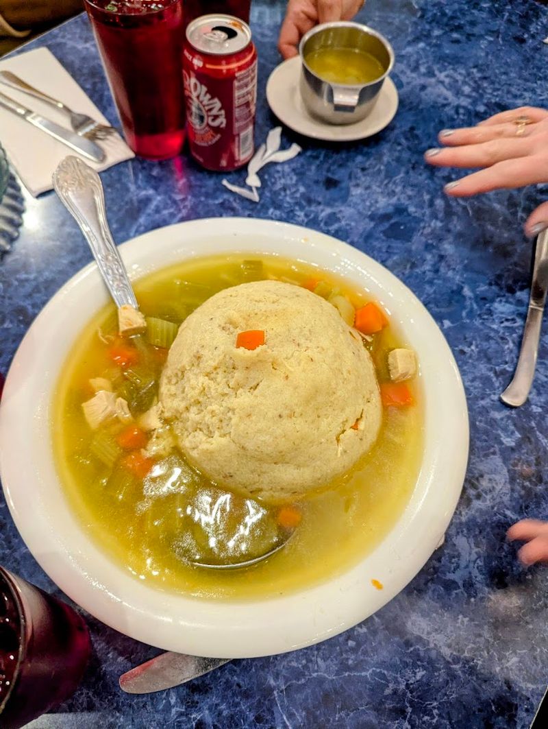 Matzo Ball Soup Served in What Can Only Be Described as a Bucket
