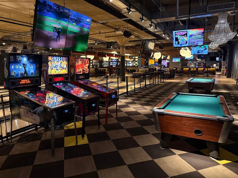 The Glowing Screens Of A Retro Arcade Paradise