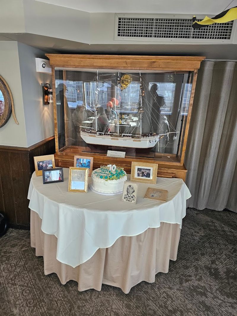 Polished Wood And Brass Railings Throughout The Dining Room