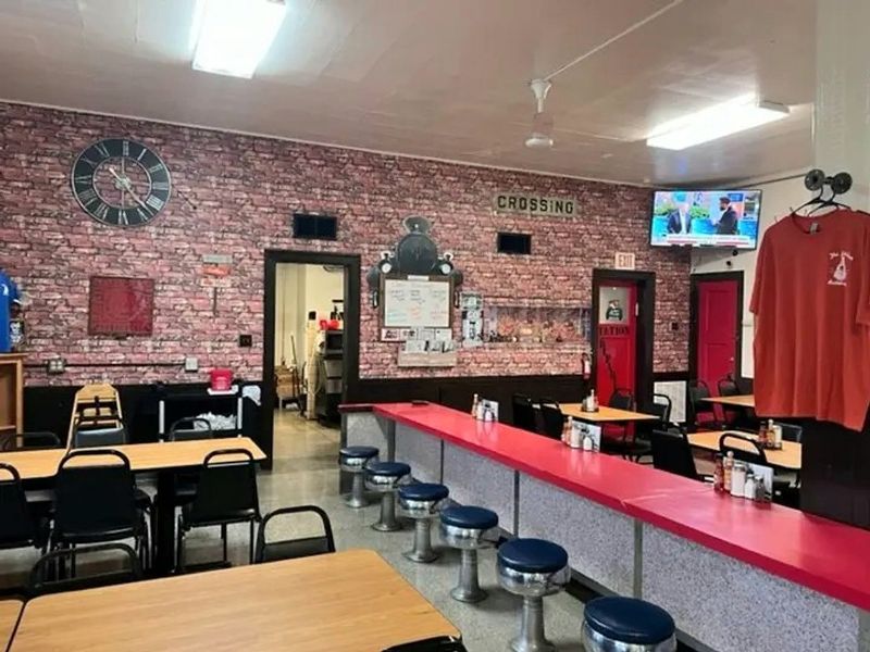 A Wrap Around Counter With Swivel Pedestal Seats