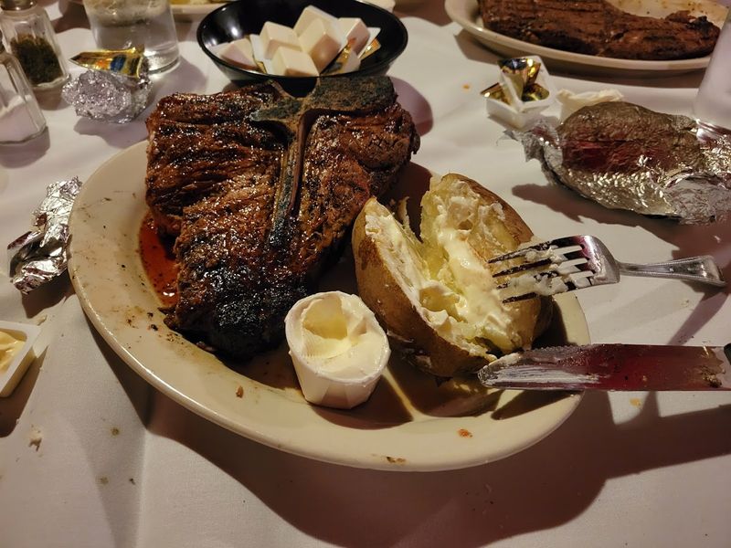 A Giant Steak That Barely Fits On The Plate