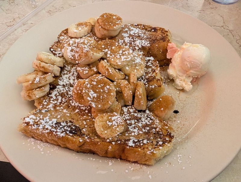 The Oversized Banana Foster French Toast Arrives Golden