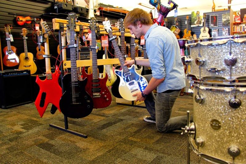 Musical Instruments Hanging Among The Used Books