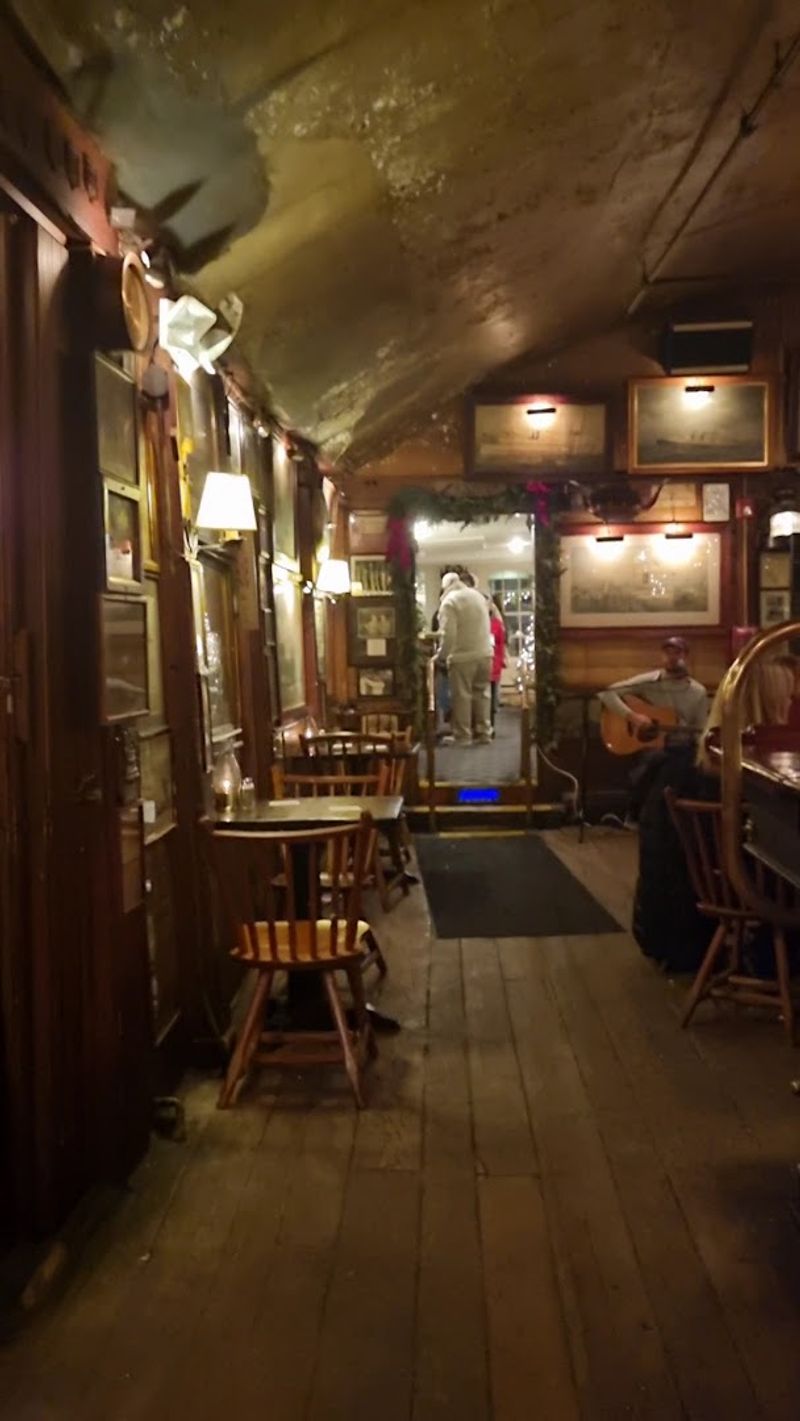 A Domed Plaster Ceiling With Flecked Brown Paint