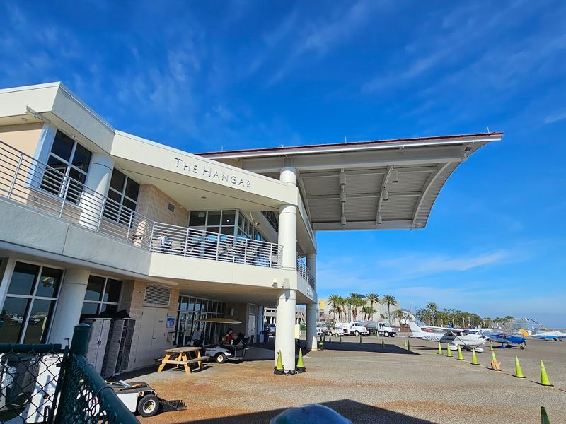 Large Windows And A Balcony Overlooking The Tarmac