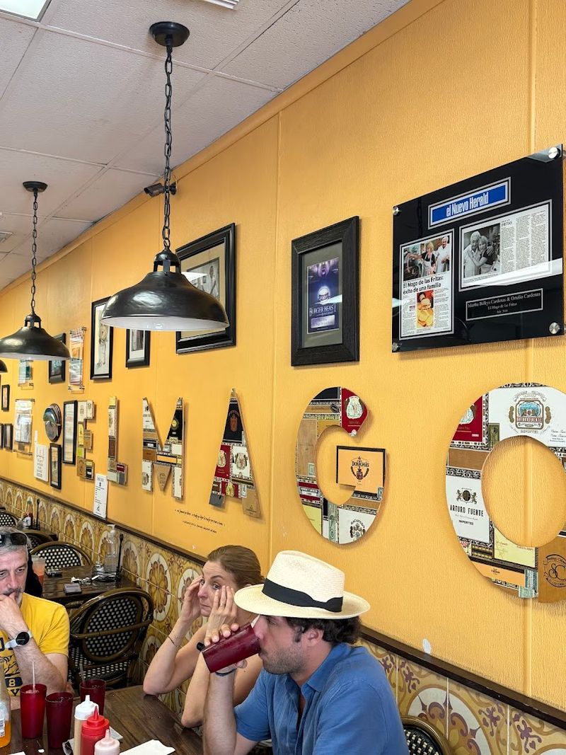 Yellow Walls Covered In Decades Of Photos And Clippings