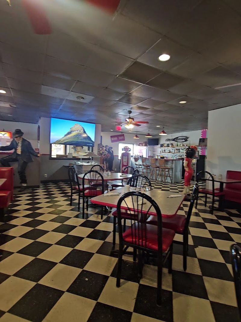 Cherry Red Vinyl Booths And Gleaming Chrome Accents