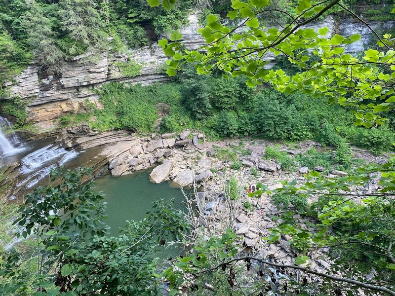 Towering Rock Walls Wrapping The Scene In Serenity