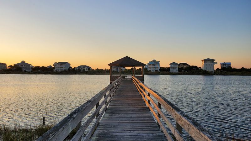 The Endless Horizon From A Wooden Walkway