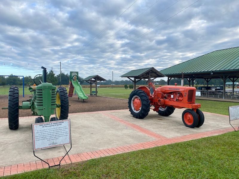 A Peachy Playground Where Kids Climb Real Tractors