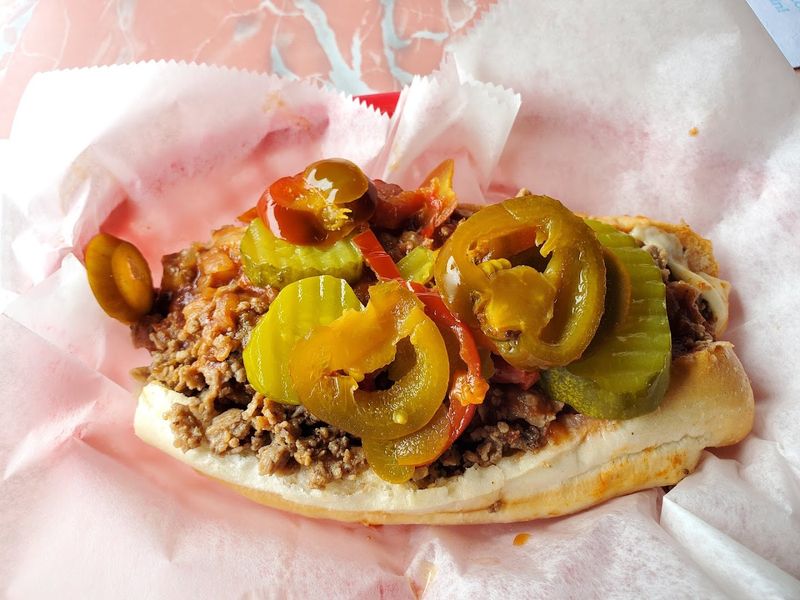 A Steak Sandwich Stacked High With Thinly Sliced Ribeye