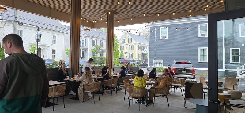 The Old Garage Doors Open For Patio Seating