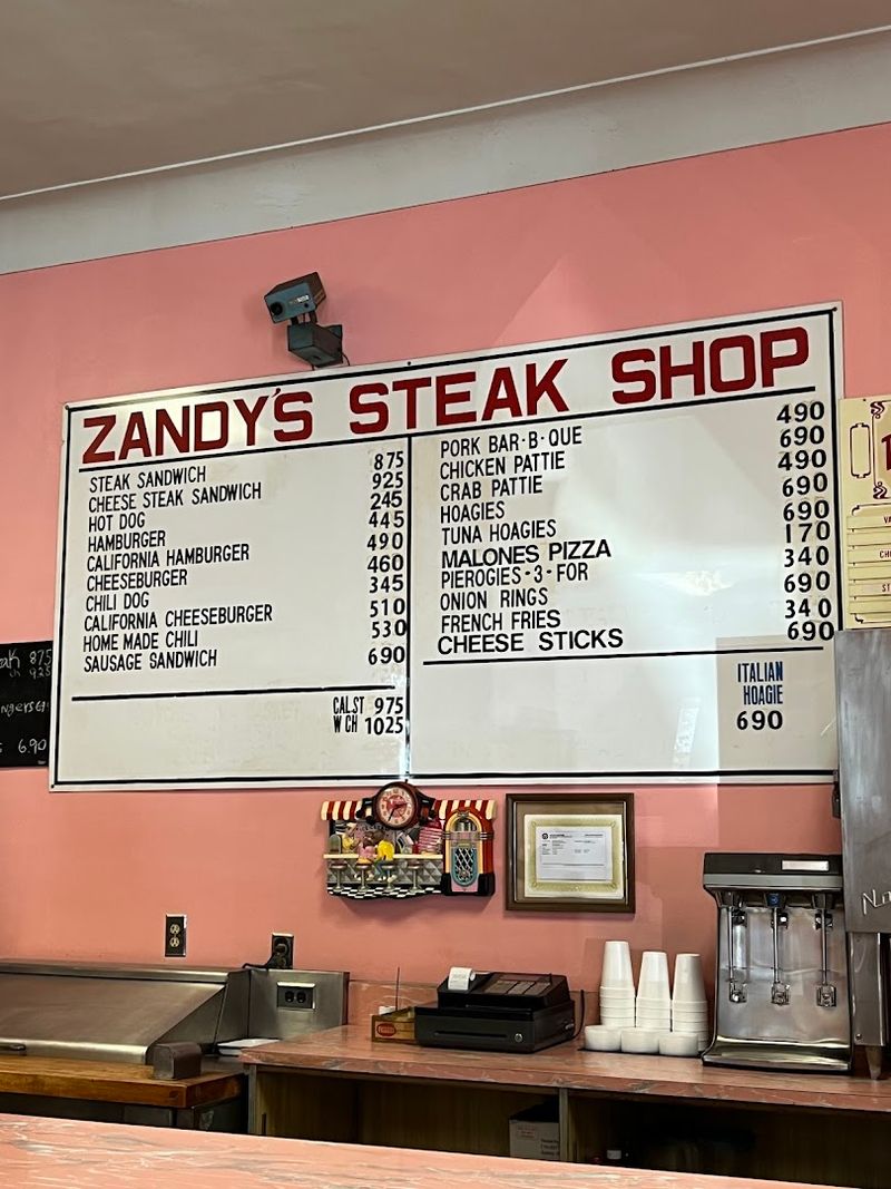 The Faded Menu Board Behind A Busy Counter