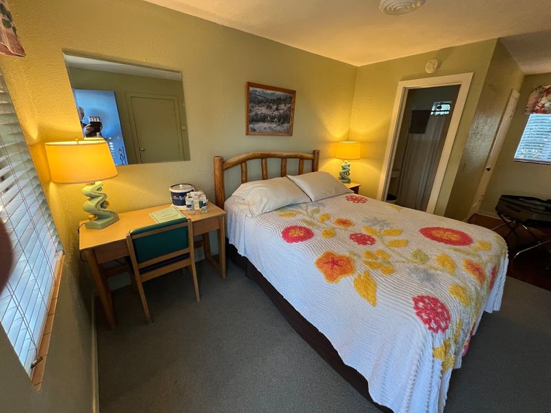 A Vintage Rotary Phone On A Cozy Nightstand