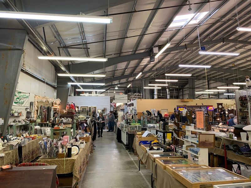 Sunlight And Smiles In A Sprawling Indoor Marketplace