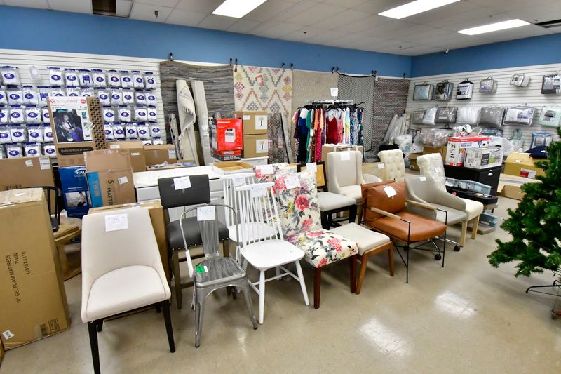 A Diverse Mix Of Electronics, Furniture, And Clothing