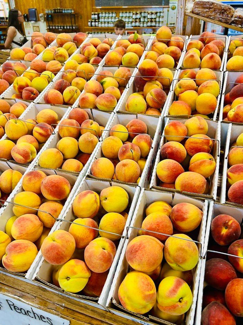 Wooden Bins Overflowing With Sunset-Colored Peaches
