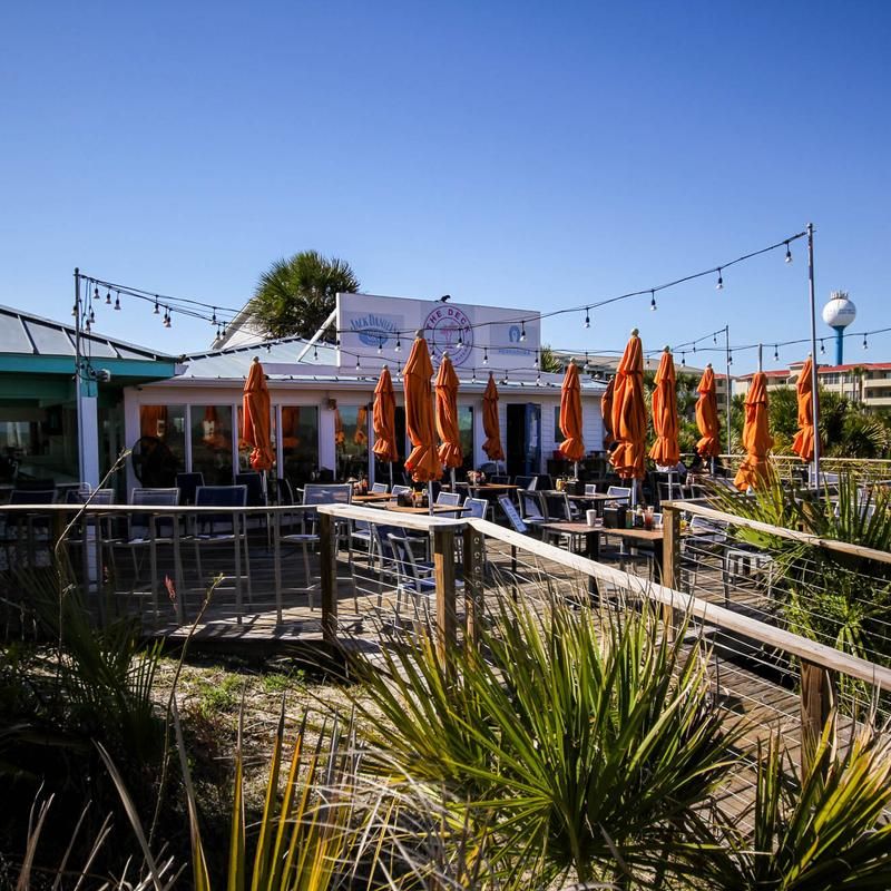 An Open Layout With Surfboards In The Rafters