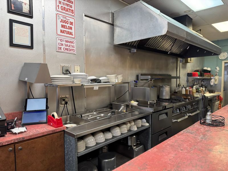 The Hum Of Sizzling Meat And Friendly Spanish Conversation