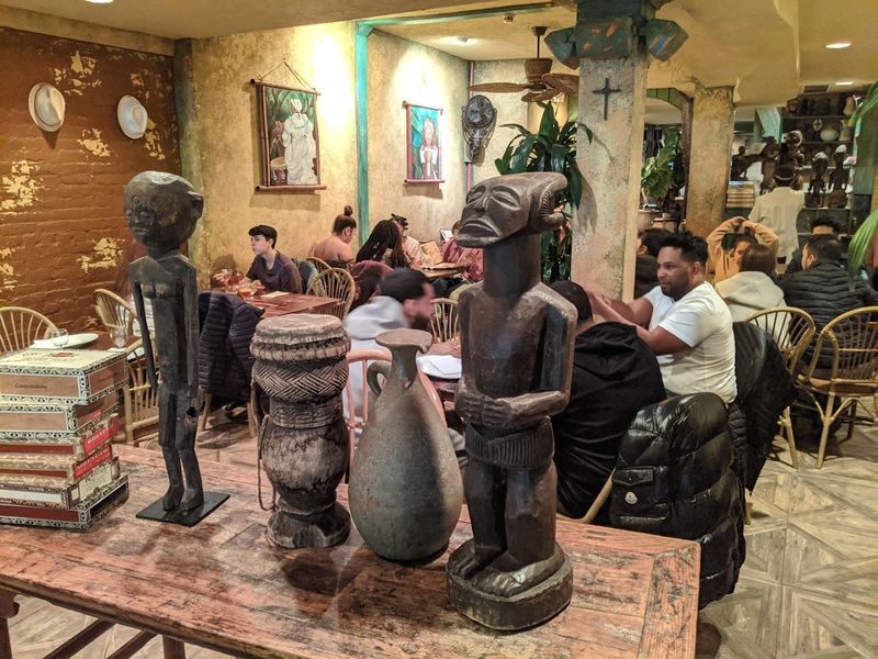 Servers in Yellow Guayabera Shirts and Panama Hats