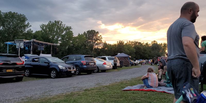 Families Spreading Blankets Under The Open Stars