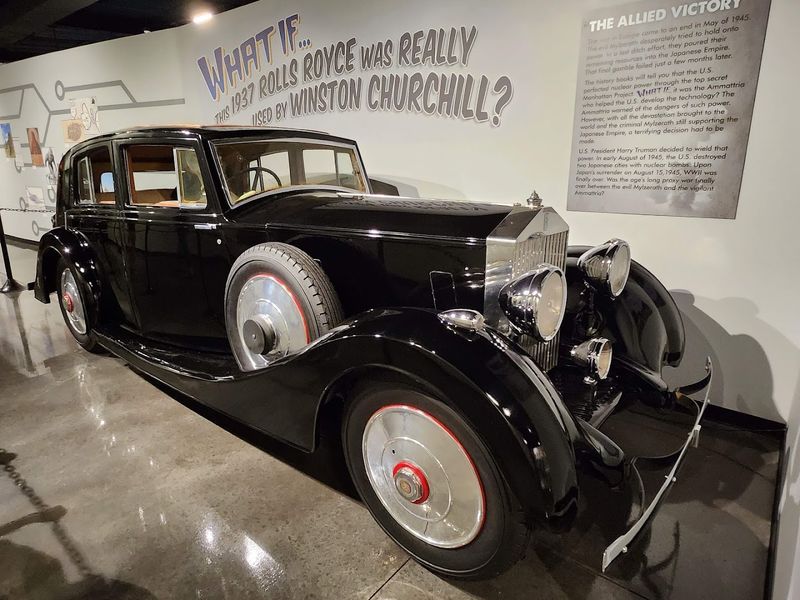A 1937 Rolls Royce And Wood Carvings Of Tortured Souls