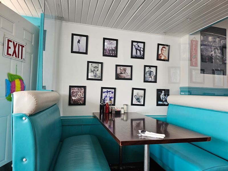 Blue Booths And A Long Counter With Stools