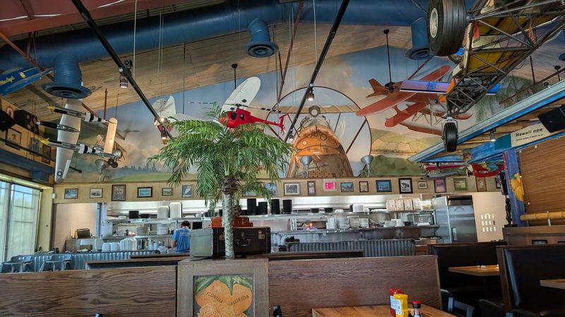 Massive Windows Framing A Living Runway Mural