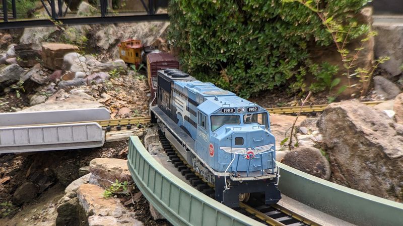 G-Scale Model Trains Winding Through Miniature Towns