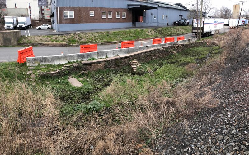 Finding the Bridge Behind a Warehouse on Main Street