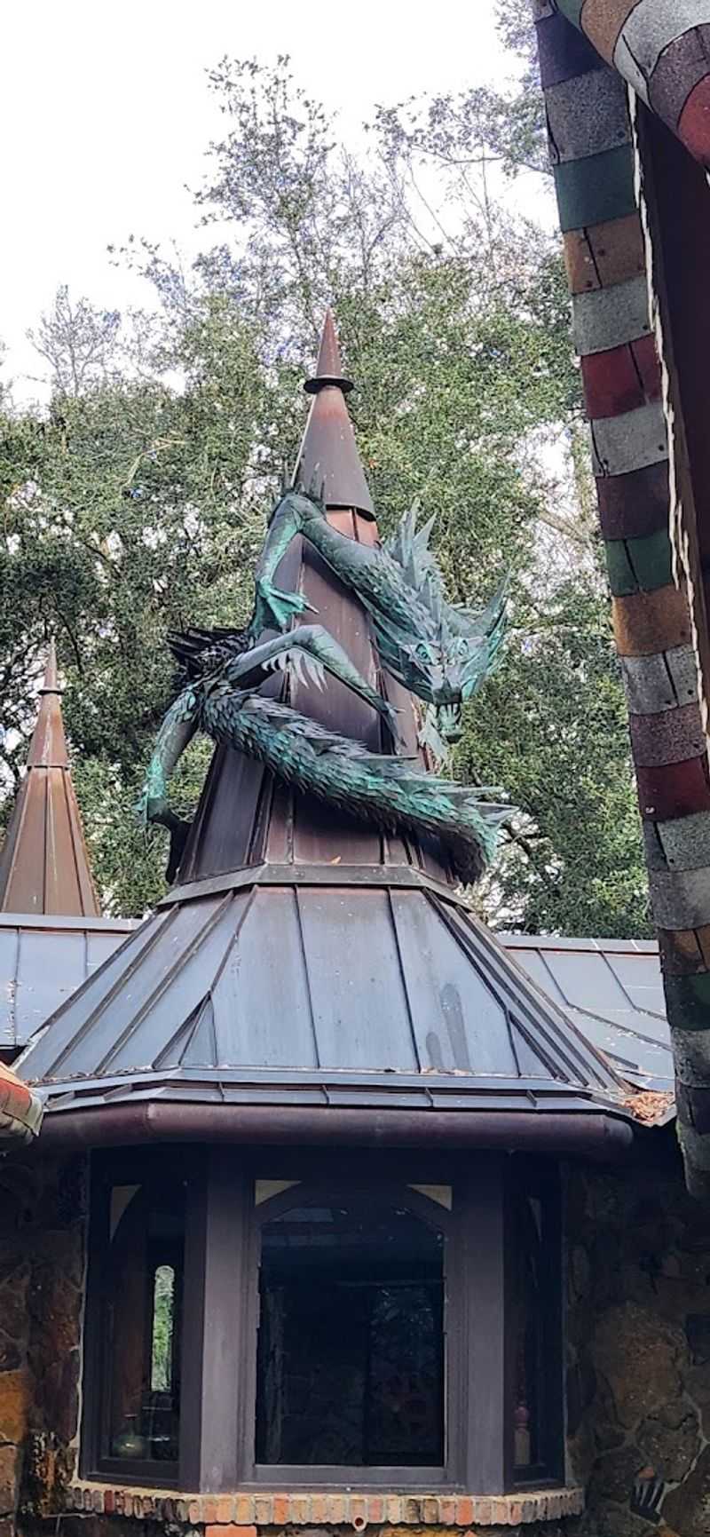 The Copper Dragon Named Hendrix Wrapping Around the Turret