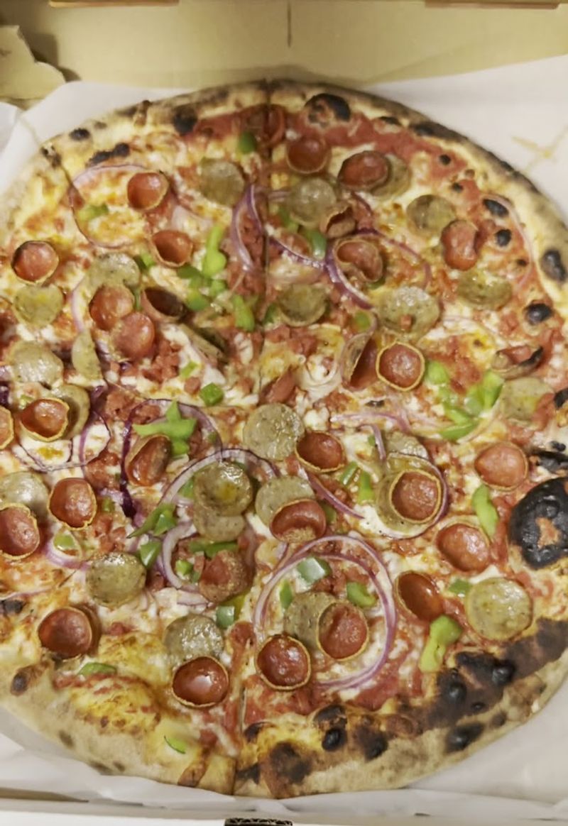 The Story Behind the Iguana Pizza That Broke the Internet