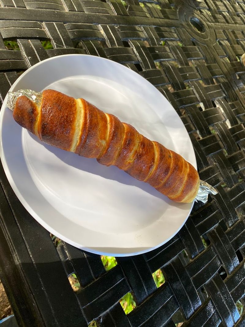 Baking Your Own Baumstriezel Over an Open Campfire