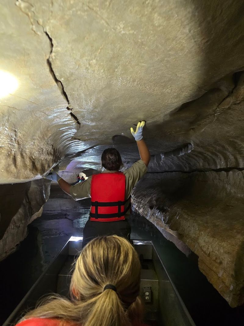 Riding a Boat Through an Underground Cave Stream