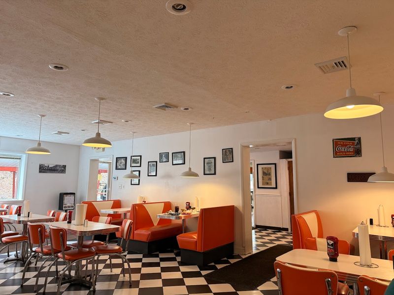 The Atmosphere Inside the Orange and White Booths