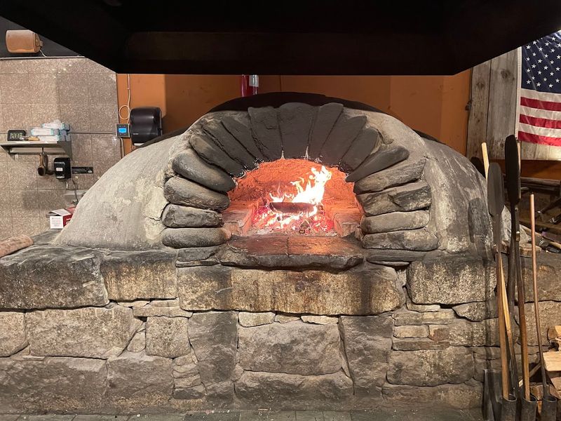The Wood-Fired Oven Is Basically the Star of the Show