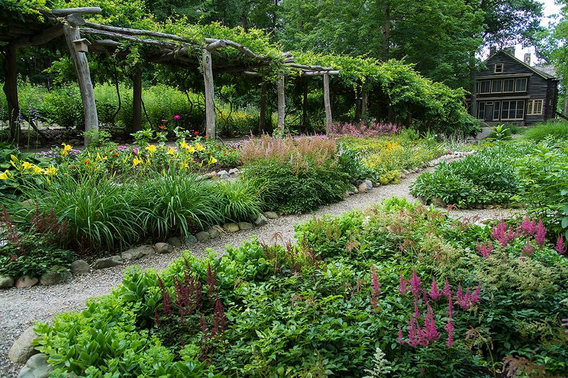 Wander Through 35 Flowerbeds Behind the Historic Cabin