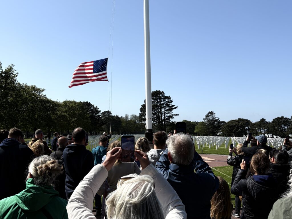 The daily lowering of the flag at the American Cemetery near Omaha Beach, Normandy.