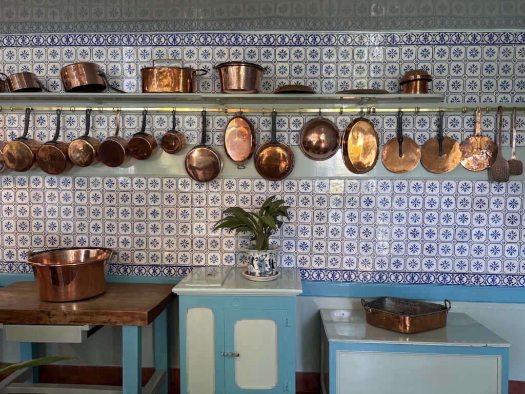 Monet's kitchen at Giverny is hung with pots and Japanese prints.