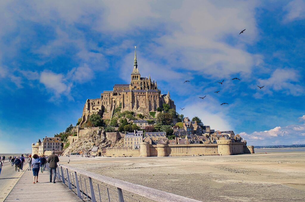 Visitors can walk to the famous isle of Mont Saint Michel during low tides!