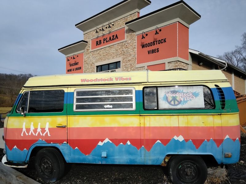 A Tie-Dyed Volkswagen Bus Greets You Outside