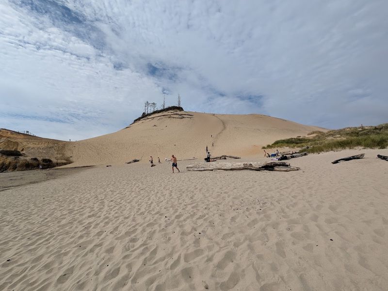 Climbing the Massive Sand Dune Above the Cape Climbing the Massive Sand Dune Above the Cape