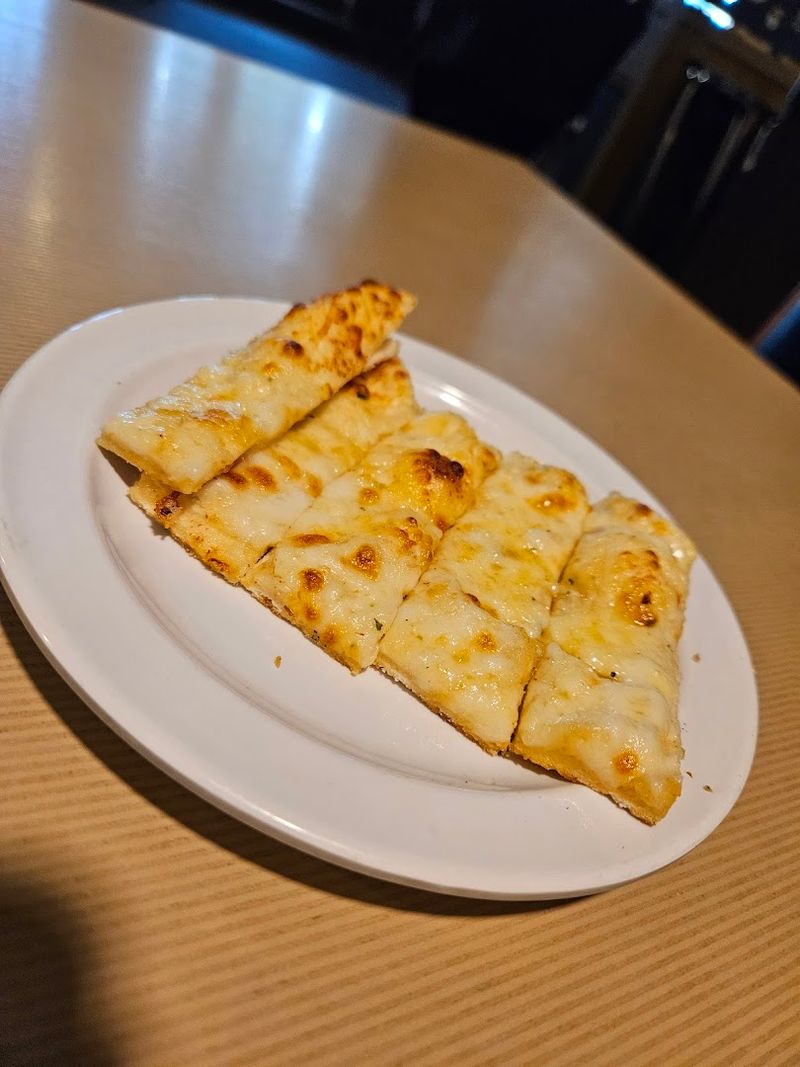 Complimentary Garlic Cheese Breadsticks That Start the Meal Right