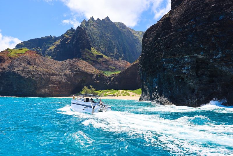 Exploring Na Pali by Boat: Sea Caves, Cliffs, and Dolphins