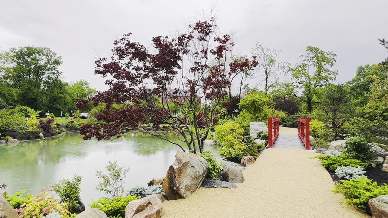 Try Reaching the Garden via the Red Railing Bridge
